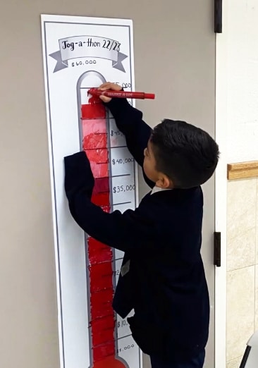 Boy with goal chart