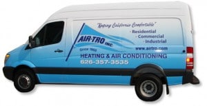 Experienced technician performing AC repair on residential unit along the 210 Corridor