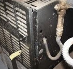 heater issues HVAC technician checking dirty air filter during heating repair in Pasadena