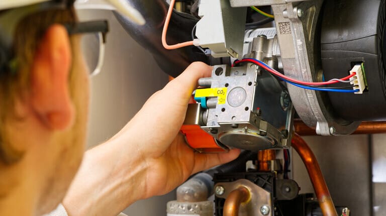 Air-Tro technician performing furnace repair in a Pasadena home